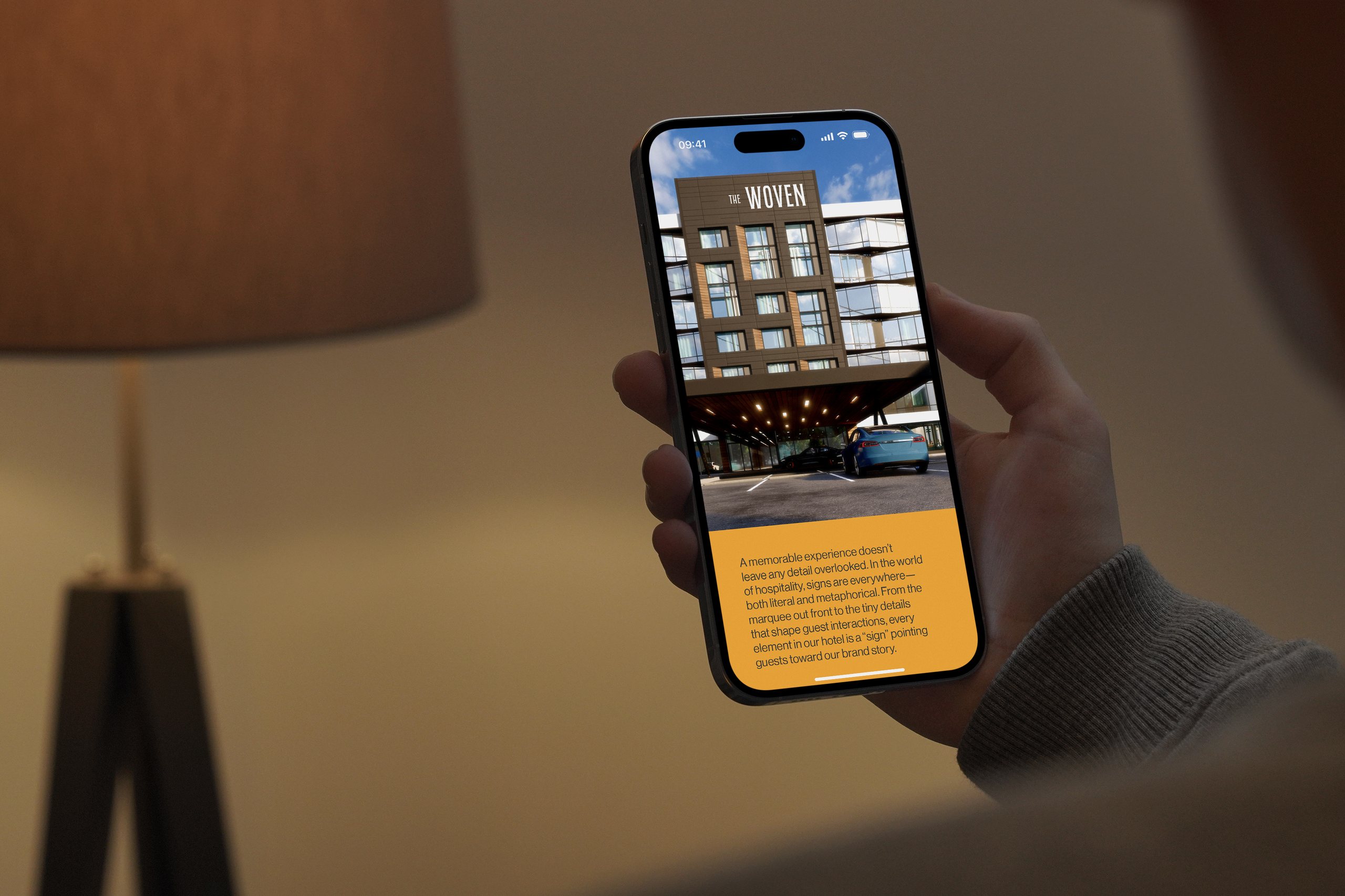 Phone showing the Woven Hotel website