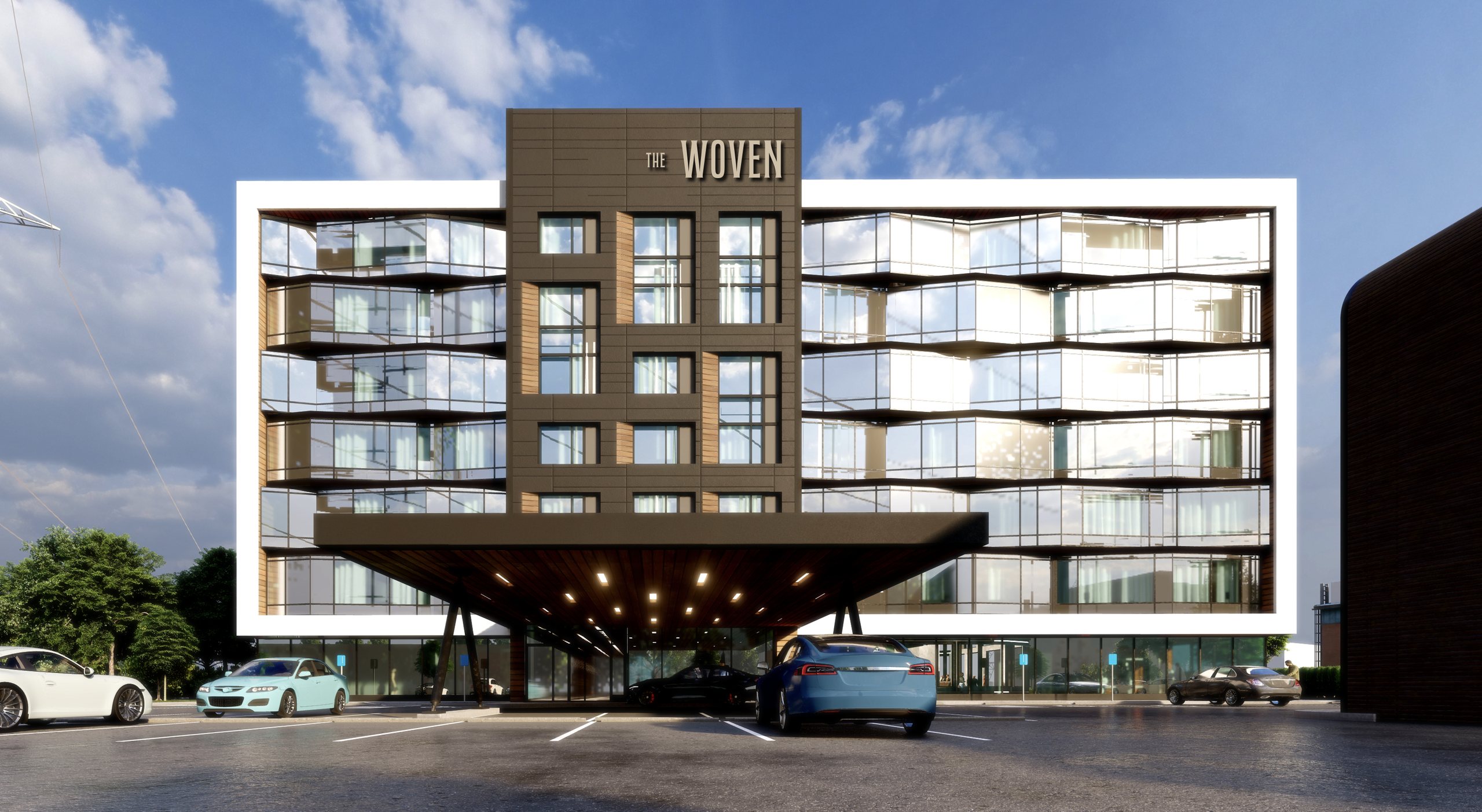 The Woven Hotel building at dusk